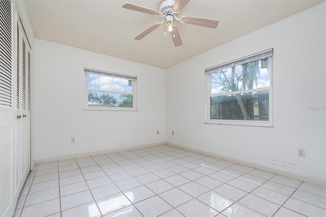 unfurnished room featuring a ceiling fan