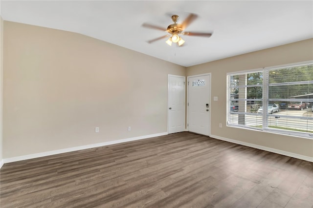 unfurnished room featuring ceiling fan, baseboards, and wood finished floors