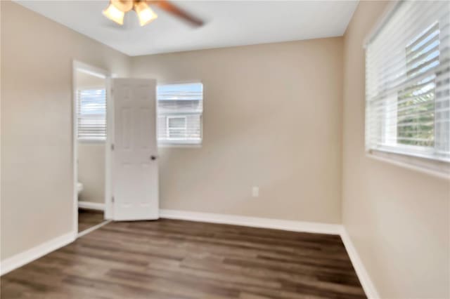 unfurnished bedroom with a ceiling fan, baseboards, and wood finished floors