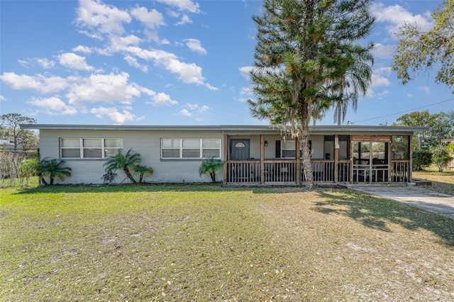 ranch-style house with driveway and a front yard