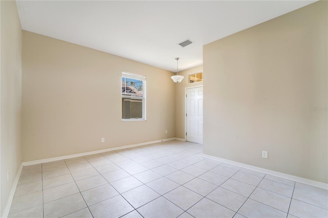 unfurnished room with visible vents and baseboards