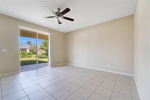 unfurnished room featuring ceiling fan and baseboards