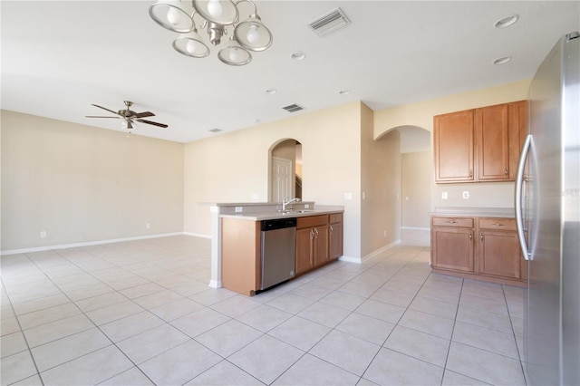 kitchen with visible vents, appliances with stainless steel finishes, light countertops, and open floor plan