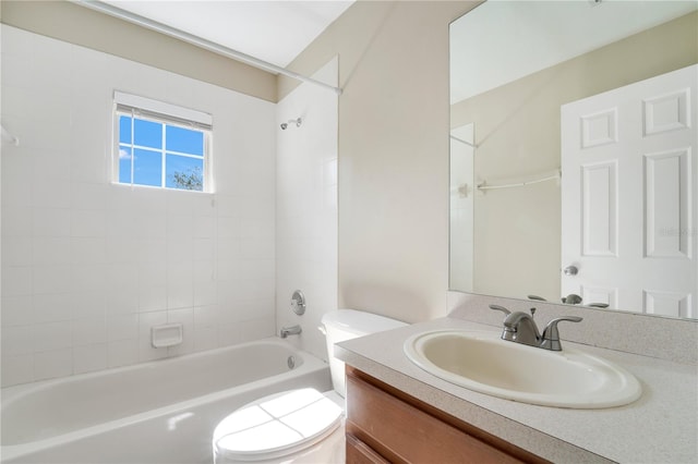 bathroom featuring vanity, toilet, and bathing tub / shower combination