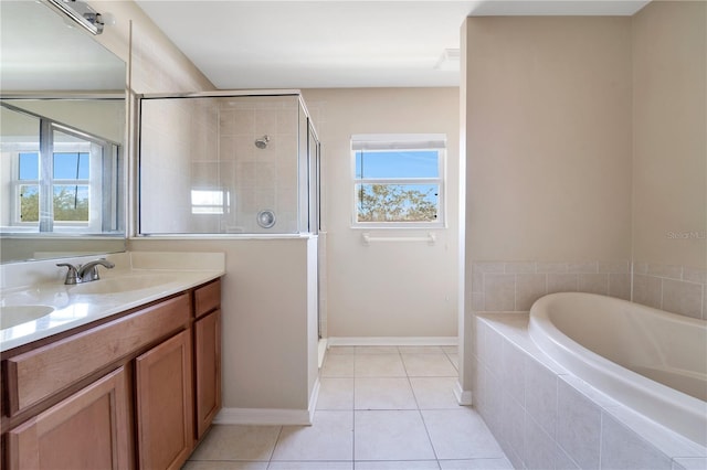 full bathroom featuring double vanity, tile patterned floors, a sink, a shower stall, and a bath