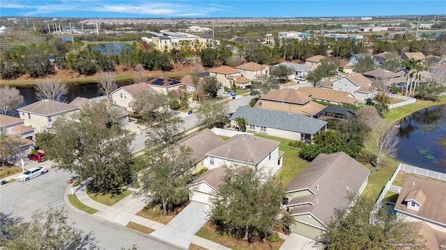 bird's eye view with a water view and a residential view