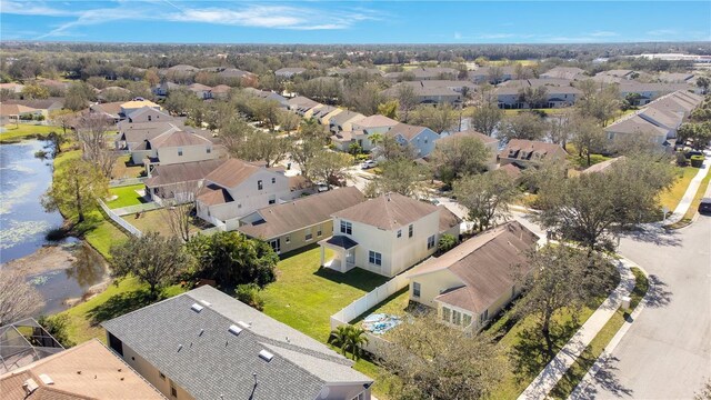 bird's eye view with a water view and a residential view