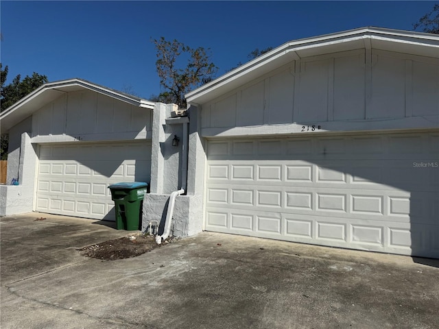 garage with concrete driveway