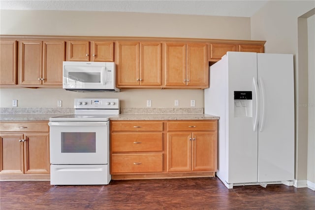 kitchen featuring white appliances, light countertops, and dark wood-type flooring