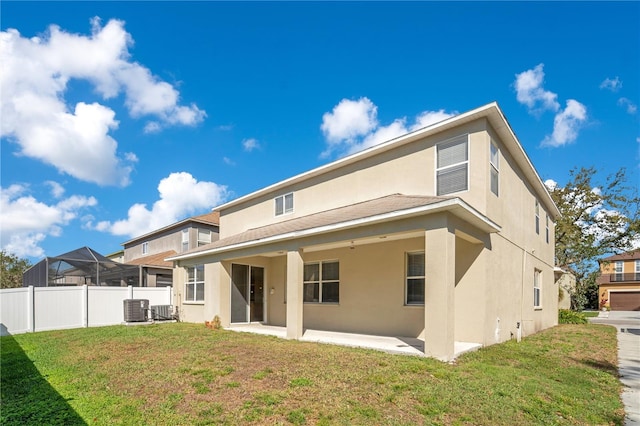 back of house featuring fence, a patio, and stucco siding