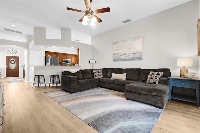 living room with light wood finished floors, visible vents, a ceiling fan, and recessed lighting