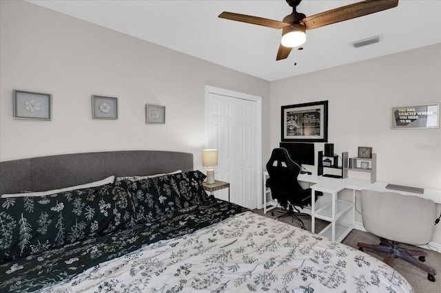 bedroom featuring a ceiling fan, visible vents, and baseboards