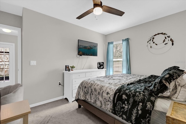 bedroom with carpet floors, ceiling fan, and baseboards