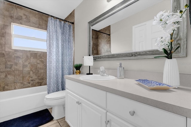 bathroom featuring shower / tub combo, vanity, toilet, and tile patterned floors