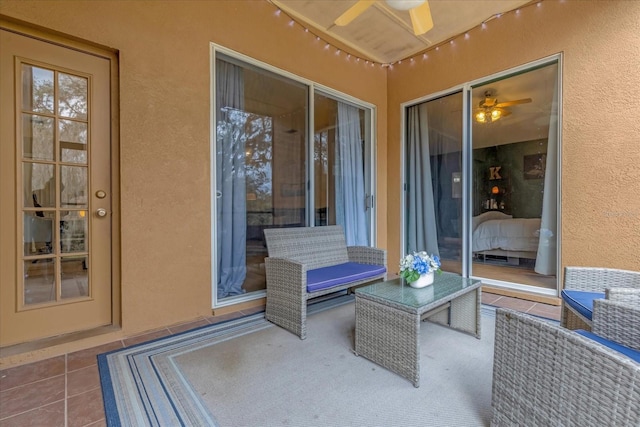 view of patio with ceiling fan and an outdoor living space