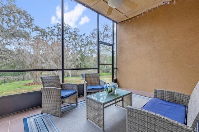 sunroom / solarium with a ceiling fan