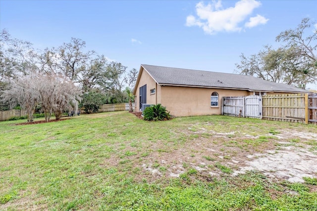 exterior space with a fenced backyard