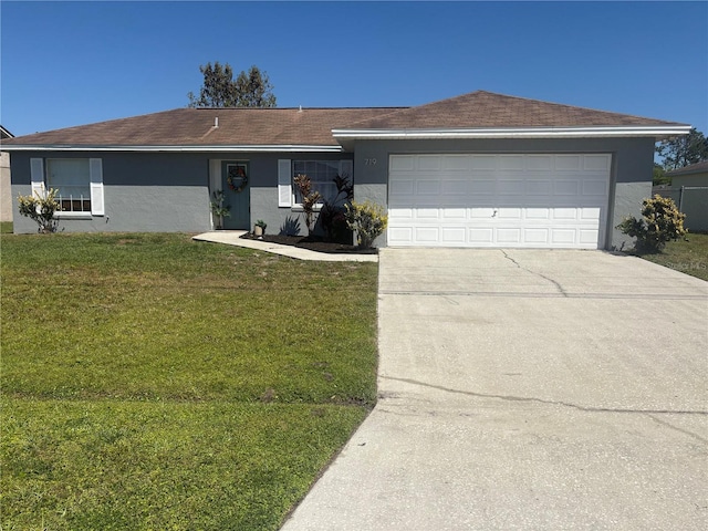 ranch-style house featuring stucco siding, an attached garage, driveway, and a front yard