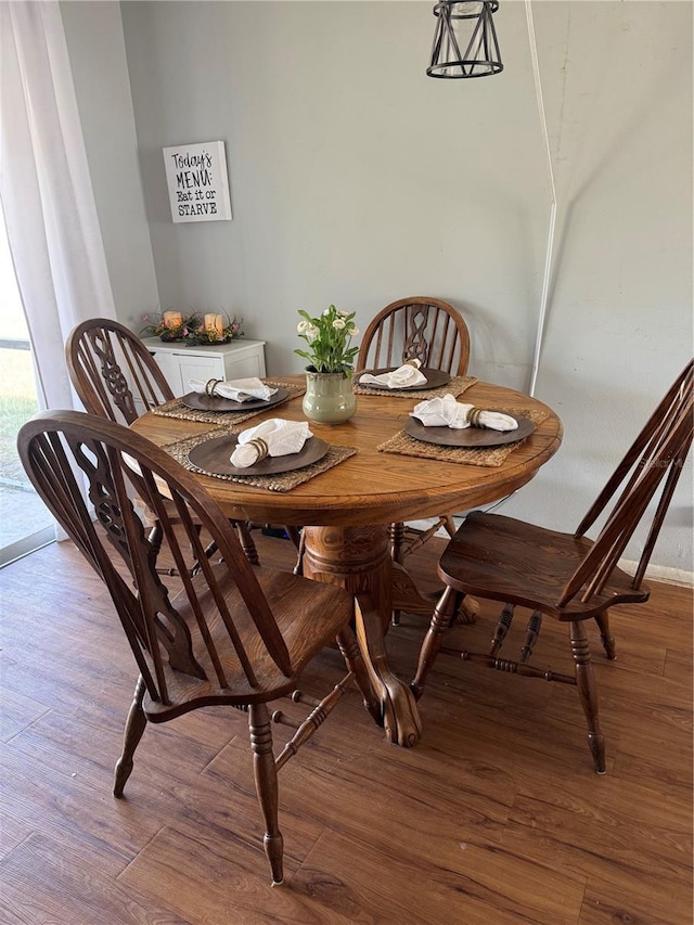 dining room with wood finished floors