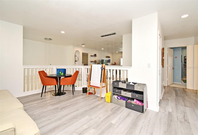 interior space featuring light wood-type flooring, visible vents, and recessed lighting