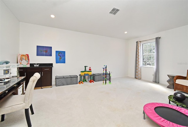 game room featuring recessed lighting, visible vents, and light carpet