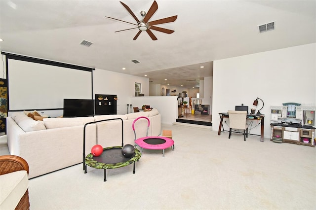 living room with light carpet, ceiling fan, visible vents, and recessed lighting