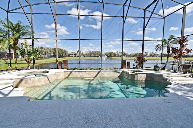 view of swimming pool featuring a lanai, a water view, and a pool with connected hot tub