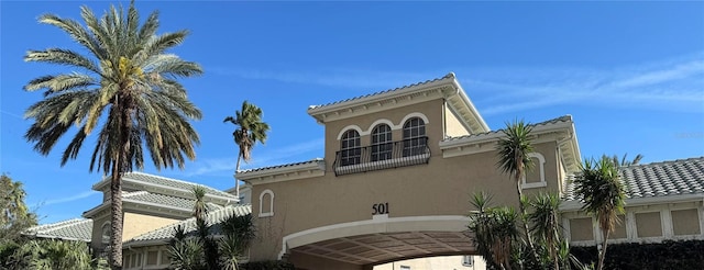 view of side of home with stucco siding