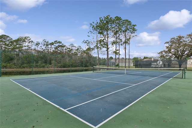 view of sport court with fence