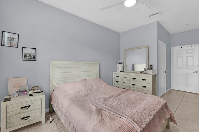 bedroom featuring baseboards, light tile patterned flooring, visible vents, and a ceiling fan