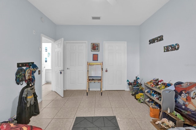 recreation room with light tile patterned floors and visible vents