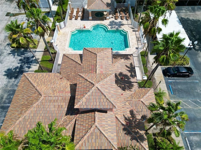 community pool featuring a patio and fence