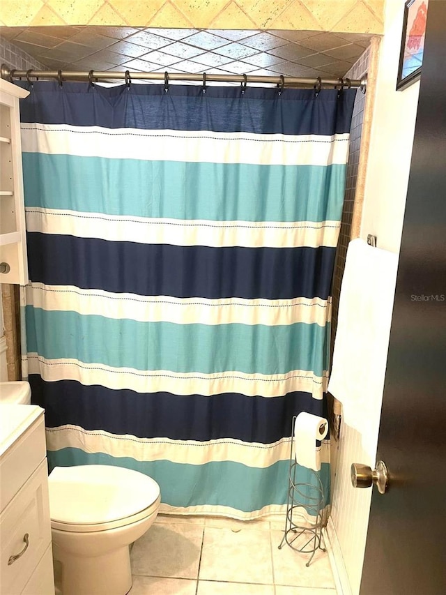 bathroom with vanity, a shower with shower curtain, tile patterned flooring, and toilet