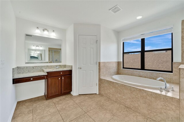 7108 Harvest Glen Ln, Riverview, FL 33578 - full bath with vanity, a bath, tile patterned flooring, baseboards, and a shower with shower door