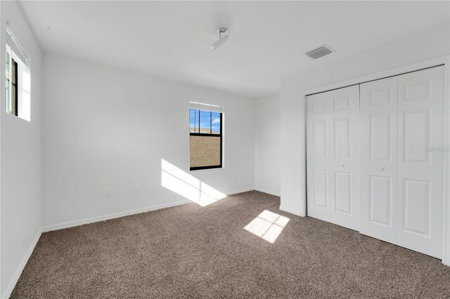 7108 Harvest Glen Ln, Riverview, FL 33578 - unfurnished bedroom with carpet flooring, baseboards, and a closet