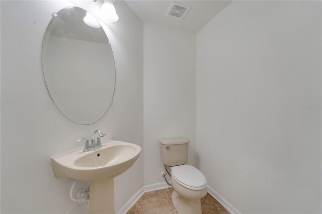 7108 Harvest Glen Ln, Riverview, FL 33578 - half bath with toilet, baseboards, and tile patterned floors