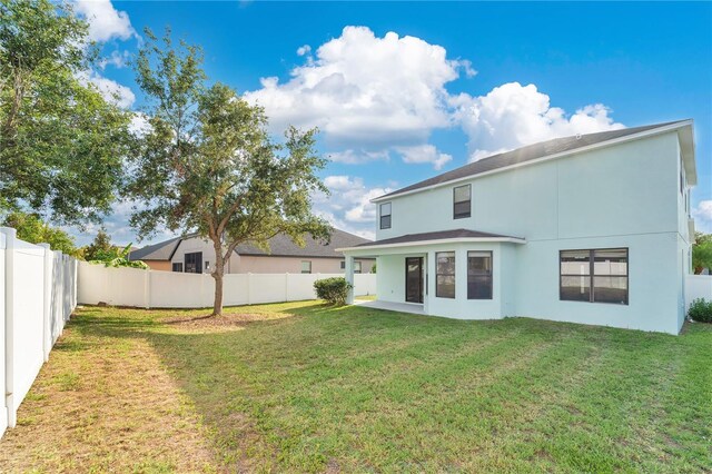 7108 Harvest Glen Ln, Riverview, FL 33578 - back of house featuring stucco siding