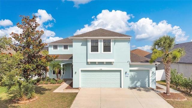 7108 Harvest Glen Ln, Riverview, FL 33578 - view of front of house featuring stucco siding, roof with shingles, an attached garage, and driveway