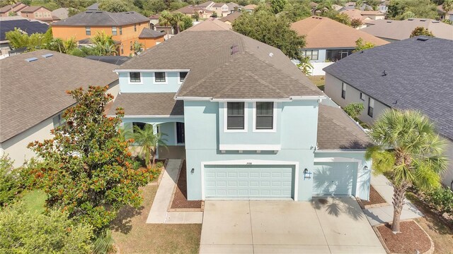 7108 Harvest Glen Ln, Riverview, FL 33578 - view of front facade featuring a shingled roof, stucco siding, and a residential view
