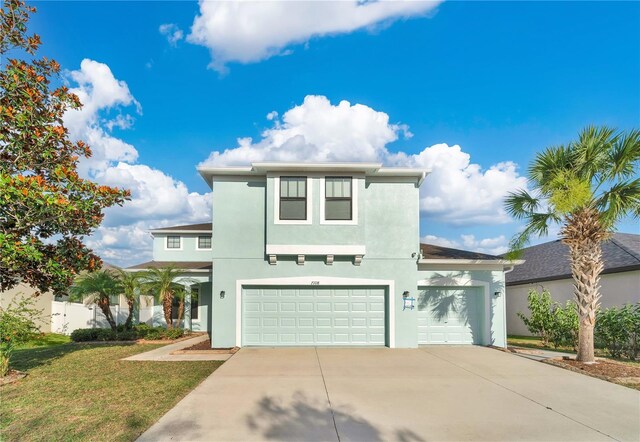 7108 Harvest Glen Ln, Riverview, FL 33578 - view of front of house featuring concrete driveway, stucco siding, an attached garage, and a front yard