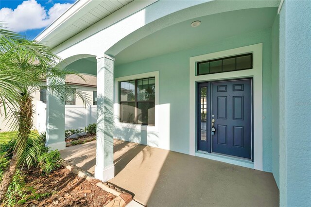 7108 Harvest Glen Ln, Riverview, FL 33578 - property entrance with stucco siding and covered porch