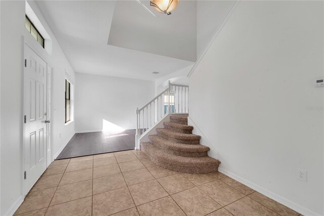 7108 Harvest Glen Ln, Riverview, FL 33578 - tiled foyer entrance featuring stairway and baseboards
