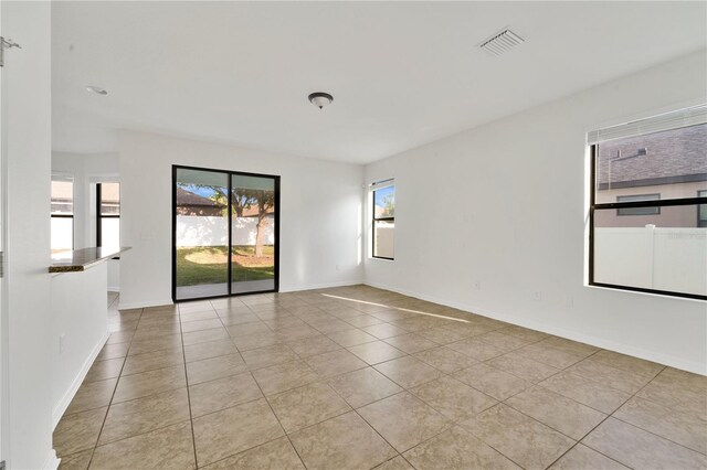 7108 Harvest Glen Ln, Riverview, FL 33578 - spare room with light tile patterned flooring and baseboards