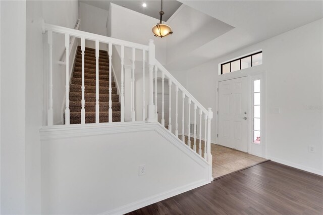 7108 Harvest Glen Ln, Riverview, FL 33578 - foyer entrance featuring stairs, wood finished floors, and baseboards