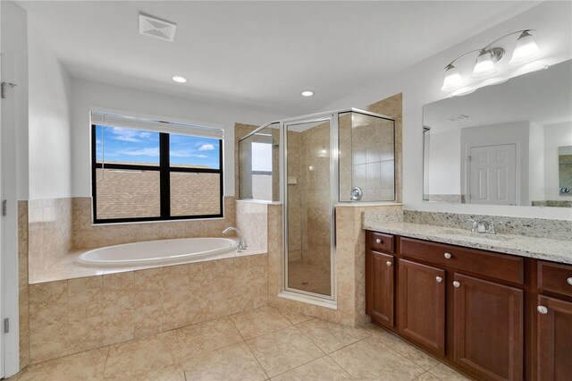 7108 Harvest Glen Ln, Riverview, FL 33578 - bathroom featuring vanity, a bath, tile patterned floors, a stall shower, and recessed lighting
