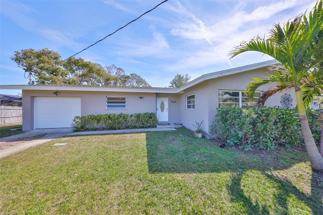 single story home with concrete driveway, a front lawn, an attached garage, and stucco siding