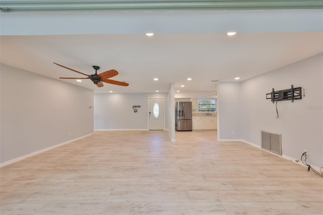 unfurnished living room featuring a ceiling fan, recessed lighting, visible vents, and light wood-style flooring