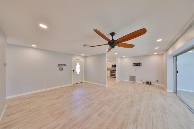 unfurnished living room featuring recessed lighting, visible vents, light wood-style flooring, a ceiling fan, and baseboards