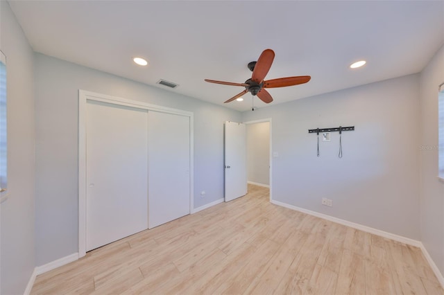 unfurnished bedroom featuring recessed lighting, visible vents, baseboards, a closet, and light wood finished floors