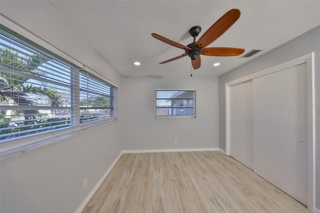 unfurnished bedroom with recessed lighting, visible vents, light wood-style flooring, and baseboards